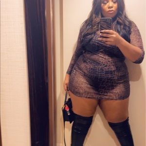 Sexy sheer snake skin print mini dress. Long sleeve